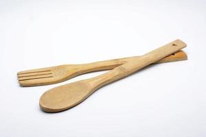 Wooden utensils on white photo