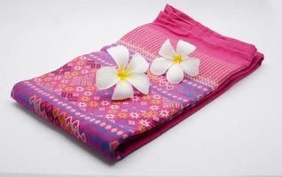 Frangipani flowers on cloth photo