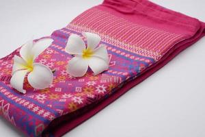 Frangipani flowers on cloth photo
