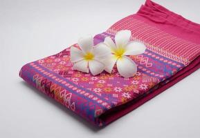 Frangipani flowers on cloth photo