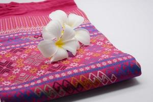 Frangipani flowers on cloth photo