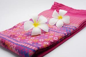 Frangipani flowers on cloth photo