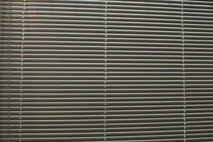 Texture of blinds. Horizontal stripes. Light through blinds. photo