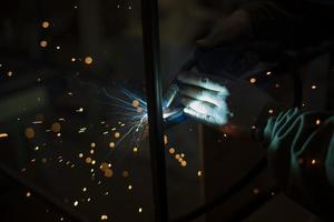 Metal welding. Welder's job. Steel processing. Creation of seam from metal. High fever. photo