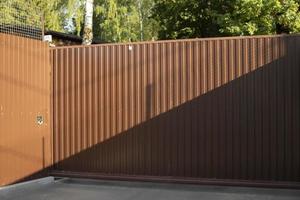 Fence in detail. Fence around house. Barrier for outsiders. photo