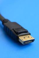 20-pin male DisplayPort gold plated connector for a flawless connection on a blue background photo