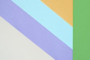 Texture background of fashion pastel colors. Violet, yellow, green, beige and blue geometric pattern papers photo