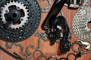 Many different metal parts and components of the running gear of a sports bike photo