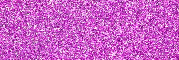 Pink decorative sequins. Background image with shiny bokeh lights from small elements photo