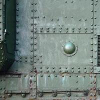 Abstract green industrial metal textured background with rivets and bolts photo