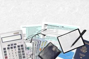 IRS form 1040 Individual income tax return lies on flat lay office table and ready to fill. U.S. Internal revenue services paperwork concept. Time to pay taxes in United States photo