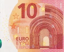 Fragment part of 10 euro banknote close-up with small red details photo