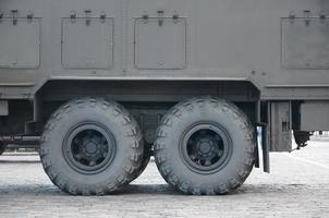 Close up of green military truck. Modern military transportation vehicle technologies photo