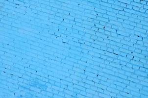 Square brick block wall background and texture. Painted in blue photo