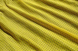 Texture of sportswear made of polyester fiber. Outerwear for sports training has a mesh texture of stretchable nylon fabric photo