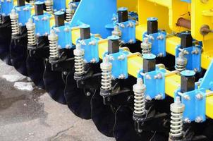 Spring system of agricultural seeder close up photo