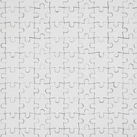 Close up texture of a white jigsaw puzzle in assembled condition. Top view. Many components of a large whole mosaic are united photo