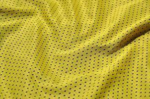 Texture of sportswear made of polyester fiber. Outerwear for sports training has a mesh texture of stretchable nylon fabric photo