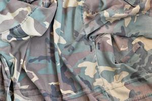 Camouflage background texture as backdrop for paintball and airsoft strikeball design projects photo