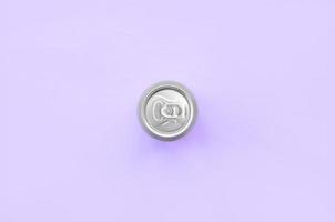 Metallic beer can on texture background of fashion pastel violet color paper in minimal concept photo