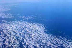 The earth is seen through the porthole of a large jet plane. photo