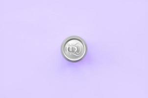 Metallic beer can on texture background of fashion pastel violet color paper in minimal concept photo