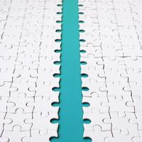 The blue path is laid on the platform of a white folded jigsaw puzzle. Texture image with copy space for text photo