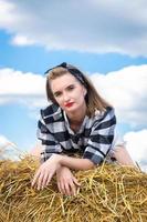 girl on a sheaf of hay photo