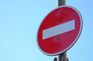 Road sign in the form of a white rectangle in a red circle. No entry photo