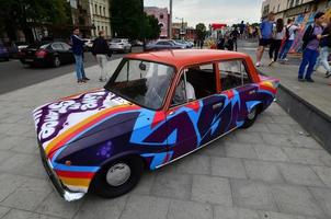 KHARKOV, UKRAINE - MAY 27, 2017 Festival of street art. A car that was painted by masters of street art during the festival. The result of the work of several graffiti artists. Original aerography photo