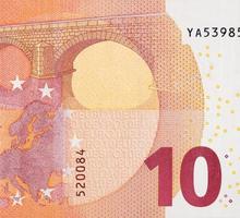 Fragment part of 10 euro banknote close-up with small red details photo