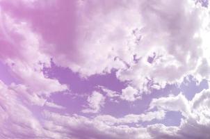 A blue sky with lots of white clouds of different sizes. Fisheye photo