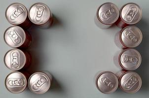 KHARKOV. UKRAINE - MAY 2, 2019 Frame of a red drink tin can Coca Cola laying on pastel blue background photo