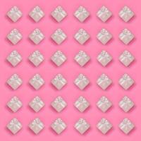 A lot of pink gift boxes lies on texture background of fashion pastel pink color paper in minimal concept. Abstract trendy pattern photo