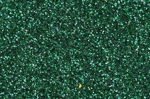 Colorful defocused emerald green background with glittering and sparkling spots photo