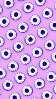 Many small plastic donuts lies on a pastel colorful background. Flat lay minimal pattern. Top view photo