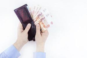 purse with money in hands photo