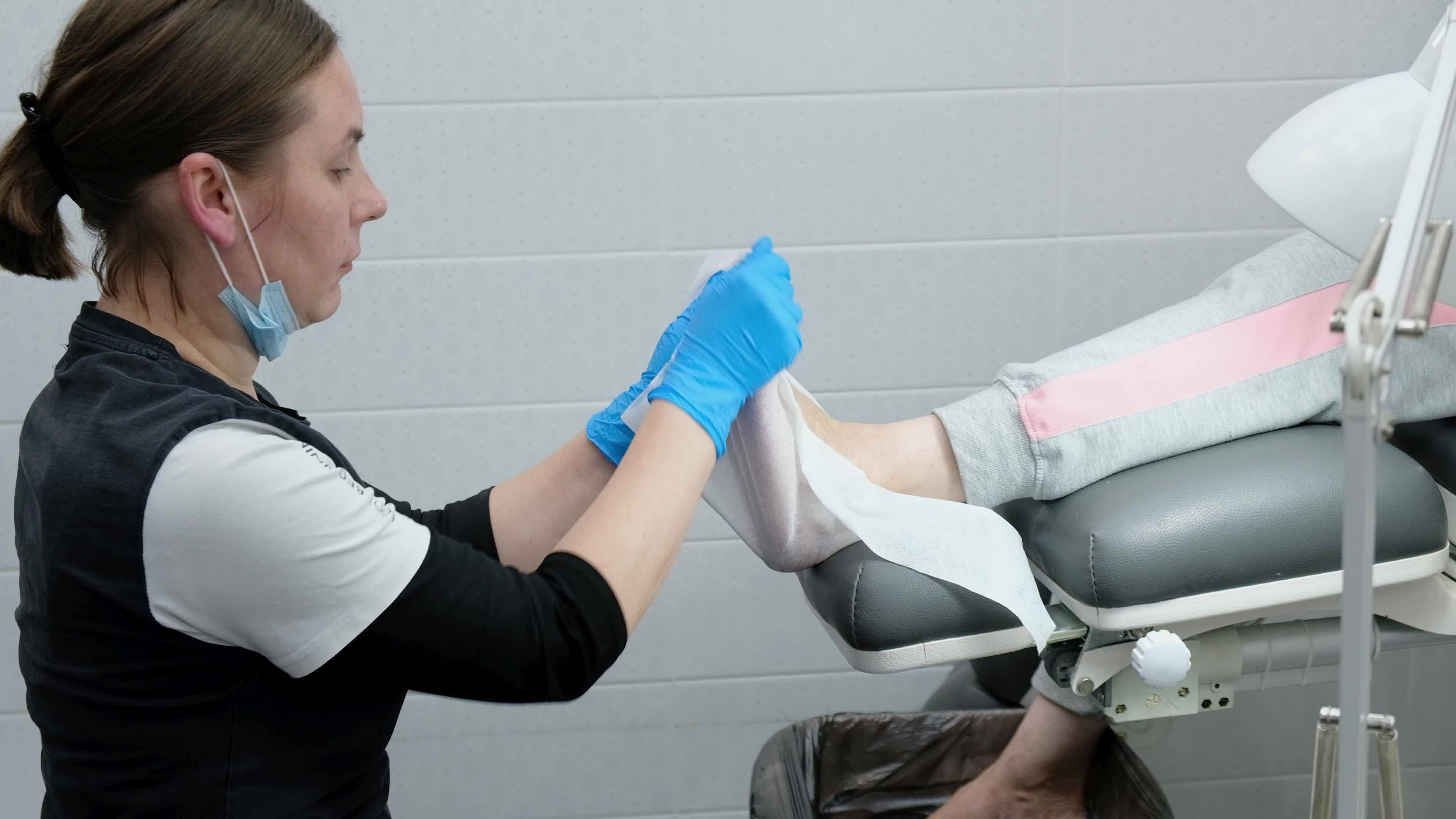 Pedicure master making procedure polish for bottom of the feet
