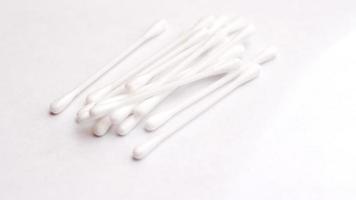 cotton buds, ears placed on a white background. photo