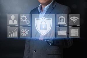 Double exposure of close up businessman pushing on key button with balck and gray background photo