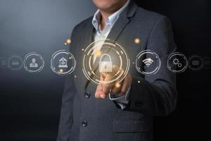 Double exposure of close up businessman pushing on key button with balck and gray background photo