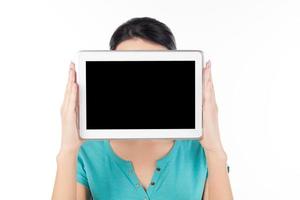 Woman with digital tablet. Woman holding digital tablet in front of her face while isolated on white photo