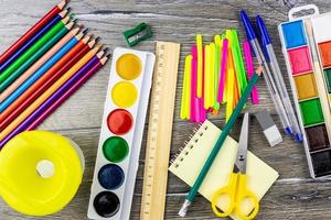 School supplies on a grey background photo