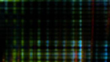 Futuristic screen pixels fluctuate with color and video motion - Loop