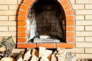 not kindled brick fireplace and firewoods photo