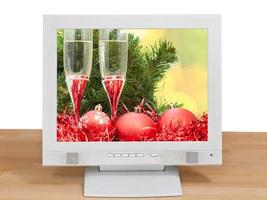 red balls and glasses on screen of gray monitor photo