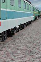 The wheels of a modern Russian electric train with shock absorbers and braking devices. The side of the cab photo