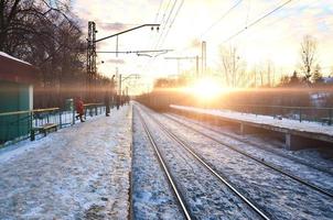 Evening winter landscape with the railway station photo