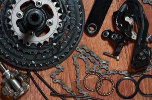 Many different metal parts and components of the running gear of a sports bike photo