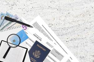Department of State form DS4139 Signature card lies on table and ready to fill. Paperwork during operations with US Passport concept photo